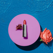 Hydracolor Lipstick bullet angled to show its smooth satin finish, Luscious Cosmetics