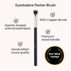 Luscious Cosmetics eyeshadow packer brush displayed on a white background with key features highlighted.