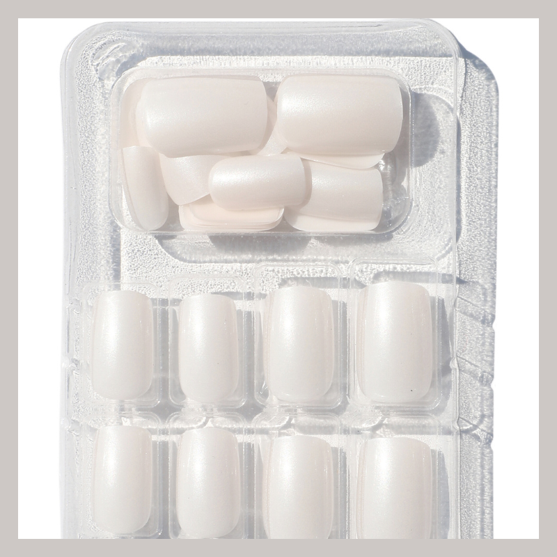 Luscious Cosmetics Angelic medium transparent press-on nails with a soft white finish.