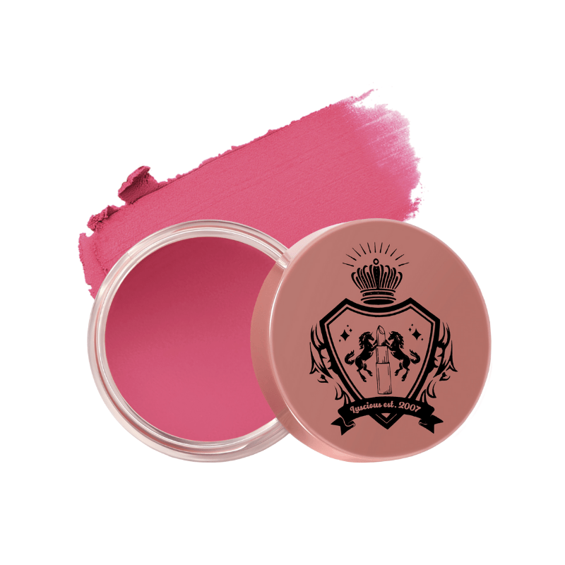 Pink cream blush in a round container with a decorative lid by Luscious Cosmetics on a white background.