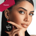 Pink cream blush in a round container with a decorative lid by Luscious Cosmetics on a white background.