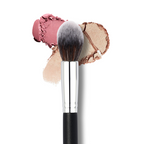 Luscious Cosmetics blush highlight brush with pink and beige powder on a white background.