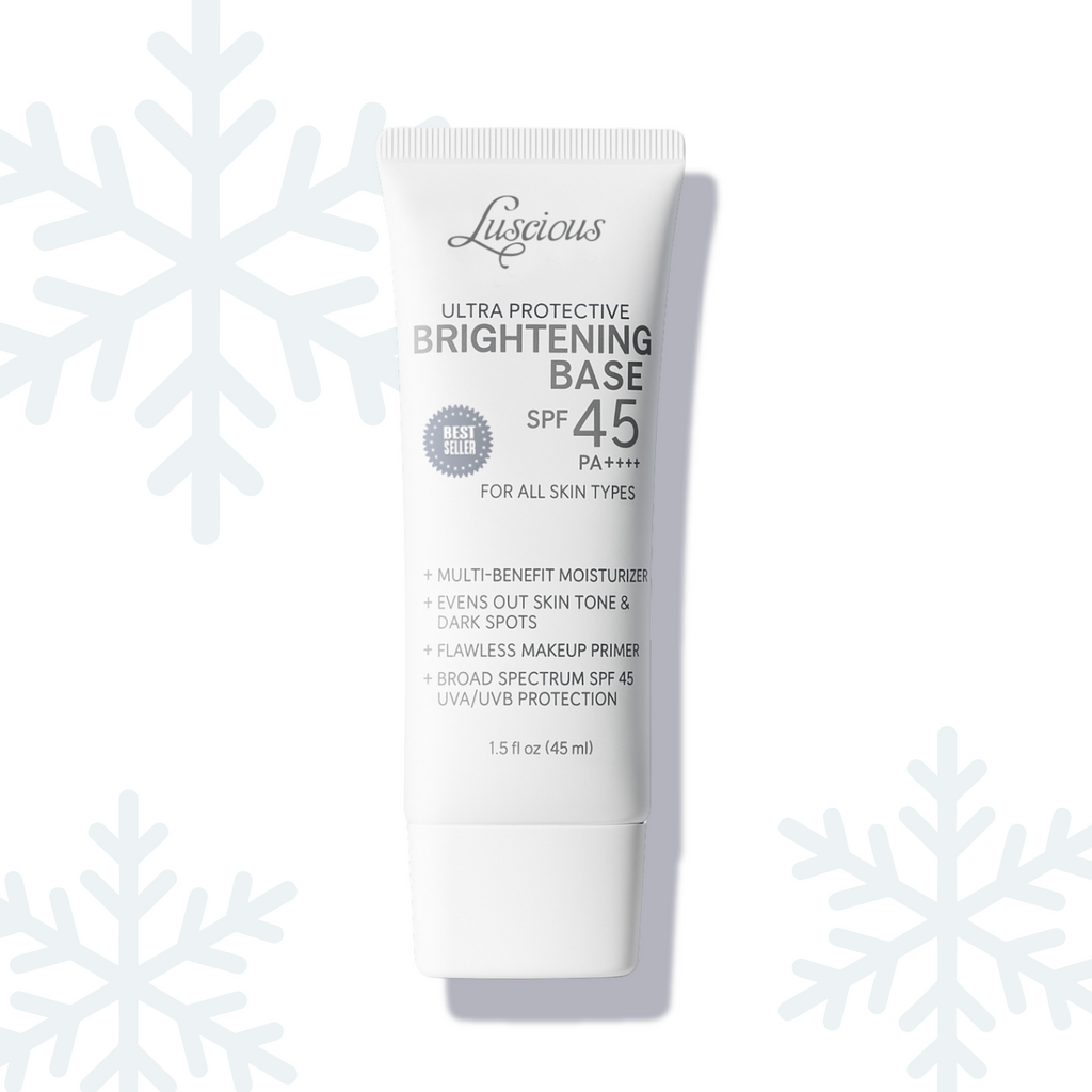 Luscious Cosmetics Ultra Protective Brightening Base SPF 45 tube displayed on a white background with snowflake decorations.