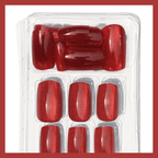 Luscious Cosmetics Dutch Roses medium press-on nails in red, displayed in clear plastic packaging on a white background.
