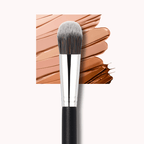 Luscious Cosmetics makeup brush with black handle and silver ferrule against a background of makeup swatches.