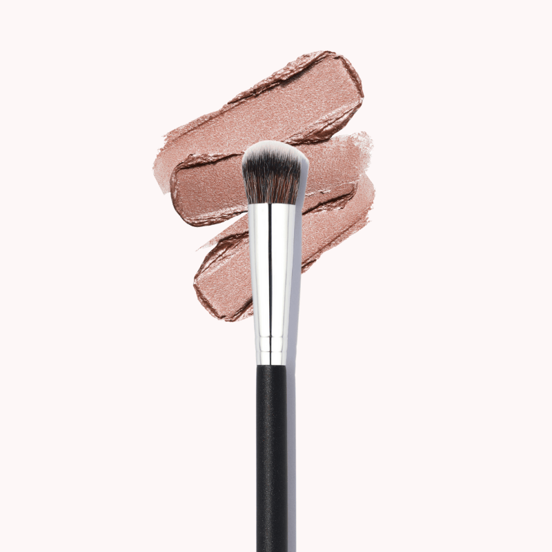 Luscious Cosmetics large shader makeup brush with silver handle shown alongside a product swatch.