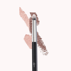 Luscious Cosmetics flat, round makeup brush with black handle and synthetic bristles shown beside loose powder.