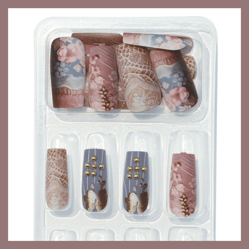 Luscious Cosmetics nail art designs displayed in a clear plastic case on a white background.
