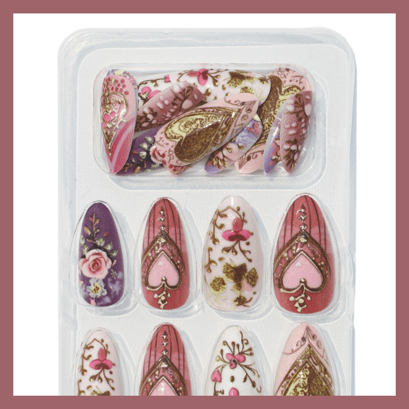 Luscious Cosmetics Queen of Hearts nail art sheets displayed in a clear plastic case.