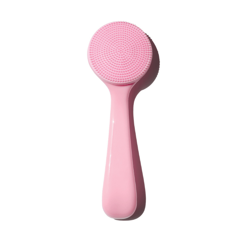 Luscious Cosmetics pink silicone makeup melter cleanser wand with textured cleansing head on a white background.