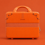 Luscious Cosmetics On the Go Vanity Case in Orange with spacious storage.