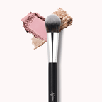 Luscious Cosmetics precision powder brush with pink and beige powder on a white background.