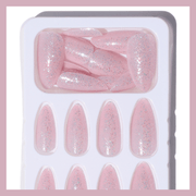Glossy pink glitter press-on nails by Luscious Cosmetics with a salon-quality finish.