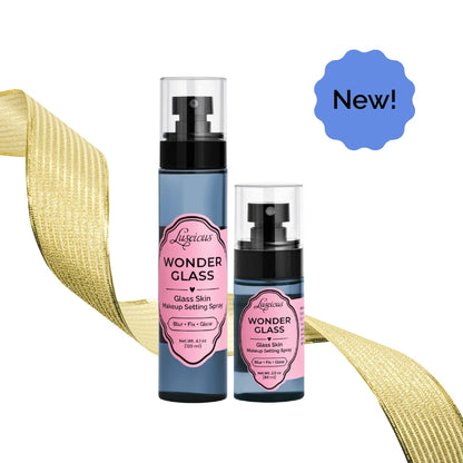 Luscious Cosmetics Wonder Glass makeup setting spray set with two bottles, gold ribbon, and New label on a white background.