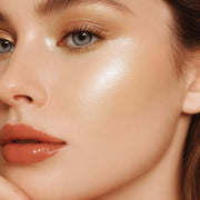 Sparkling Shimmer Highlighter in Starlight worn by a model, Luscious Cosmetics